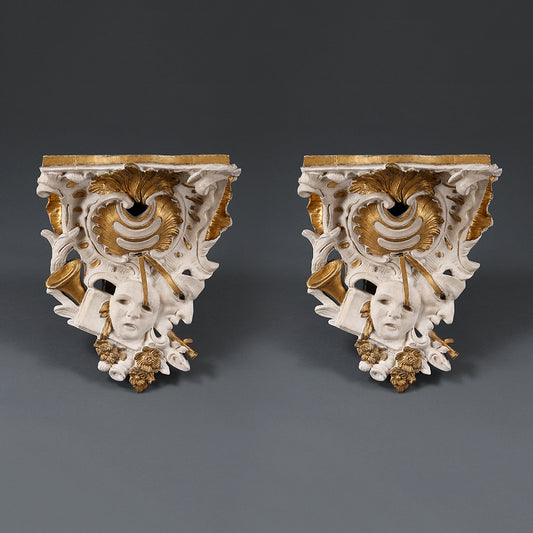 A PAIR OF PARCEL GILT ROCOCO PLASTER WALL BRACKETS