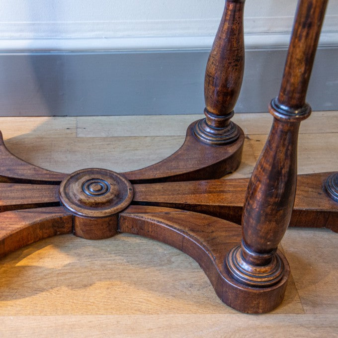 AN OVAL ITALIAN WALNUT CENTRE TABLE