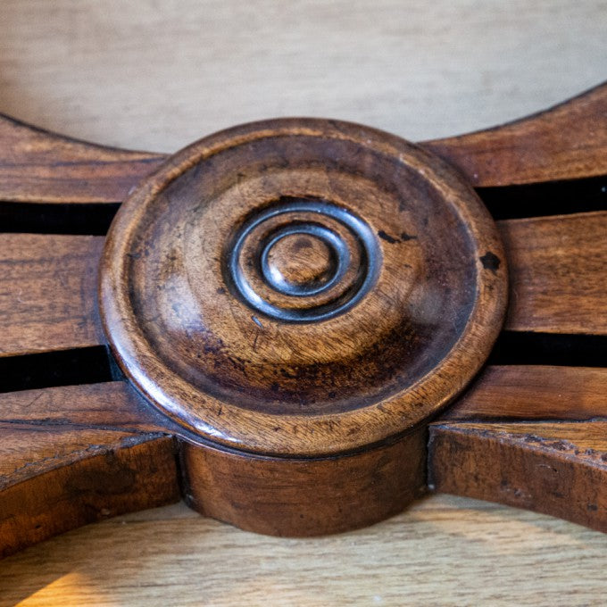 AN OVAL ITALIAN WALNUT CENTRE TABLE