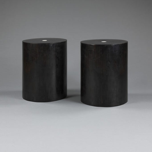 A PAIR OF BLACK STOOLS / TABLES