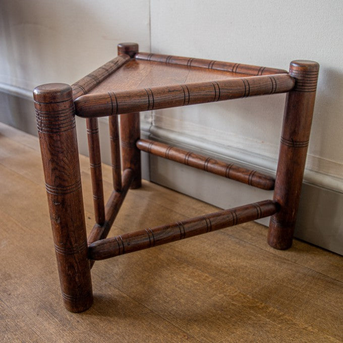 A TRIANGULAR THREE-SQUARE OAK SIDE TABLE