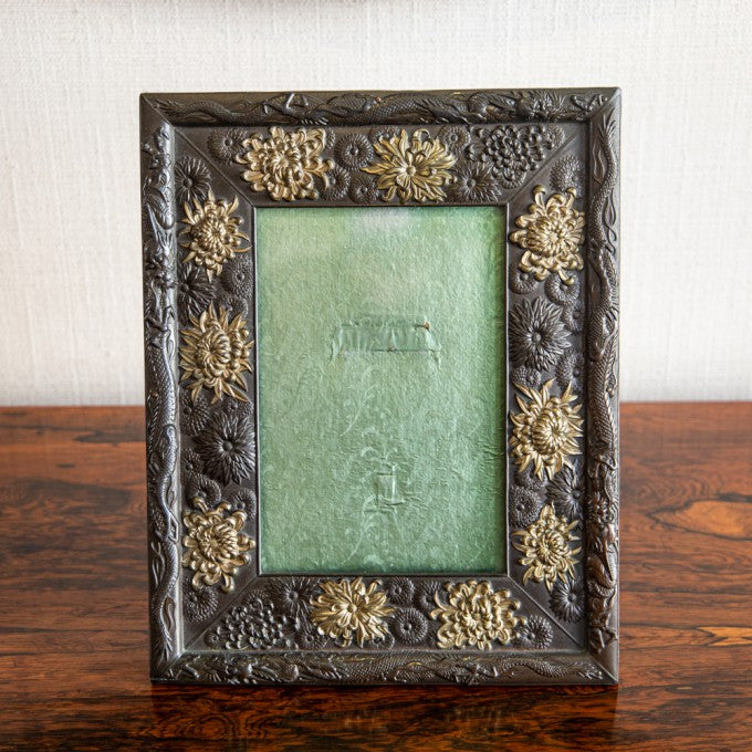 A VERY FINE REPOUSSÉ PHOTOGRAPH FRAME