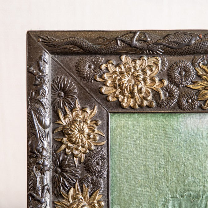 A VERY FINE REPOUSSÉ PHOTOGRAPH FRAME
