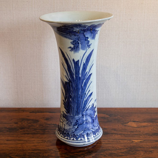 A BLUE AND WHITE TRUMPET VASE