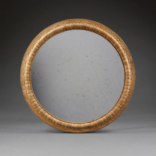 AN INDIAN CARVED HARDWOOD MIRROR