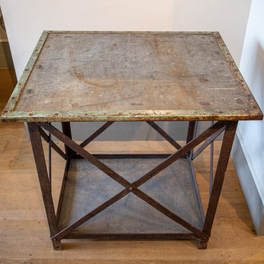 AN INDUSTRIAL RECLAIMED METAL CENTRE TABLE