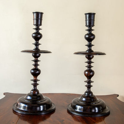 A Pair of Ebony Turned Candlesticks
