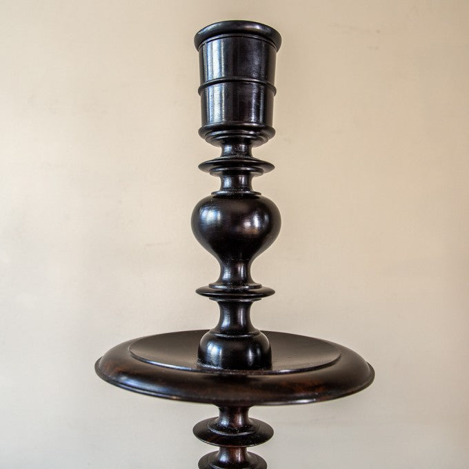 A PAIR OF EBONY TURNED CANDLESTICKS