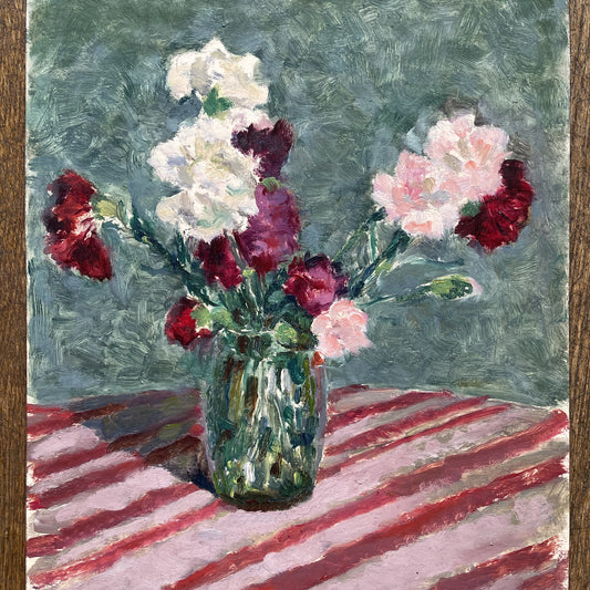 CARNATIONS IN A GREEN VASE ON A PINK STRIPED TABLECLOTH