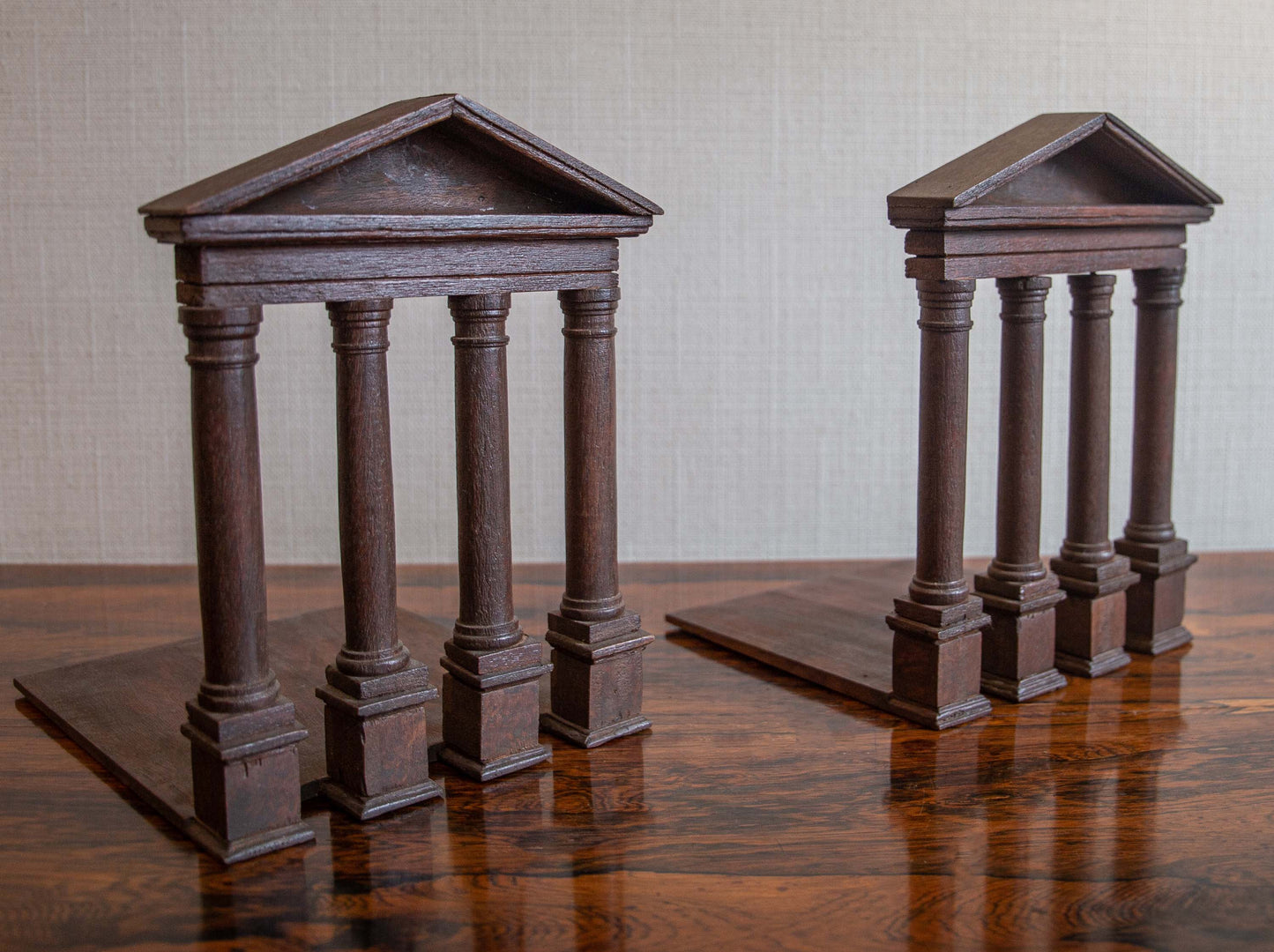 A PAIR OF MAHOGANY BOOKENDS