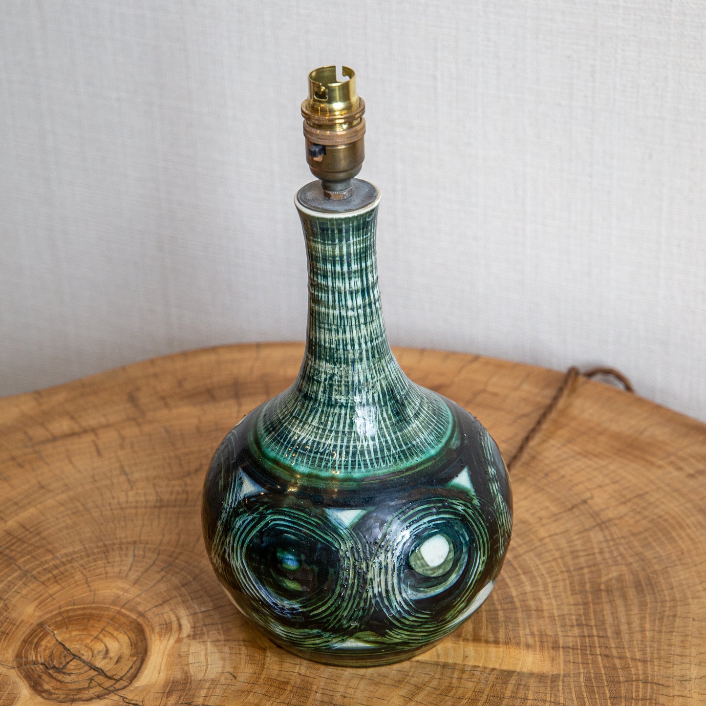 A SMALL CERAMIC LAMP WITH SCRATCH DECORATION