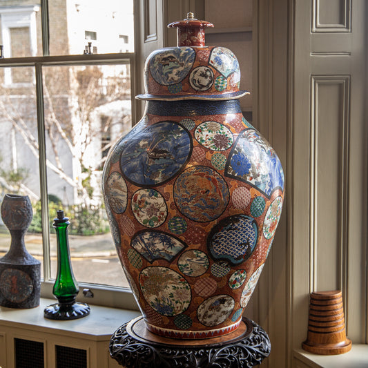 AN UNUSUALLY LARGE JAPANESE IMARI VASE AND COVER
