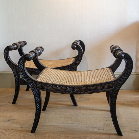 A PAIR OF EBONY ANGLO-INDIAN DESIGN STOOLS