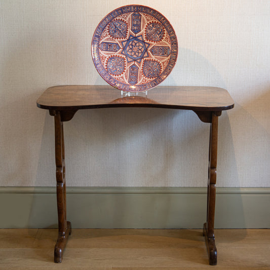 A FADED ROSEWOOD WRITING TABLE